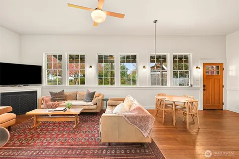 a living room with furniture fireplace and a flat screen tv