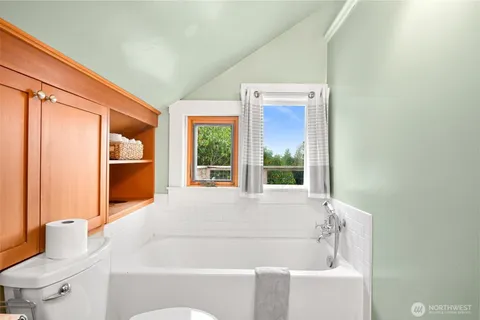 a bathroom with a bathtub and a sink