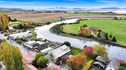 an aerial view of a house with a lake view