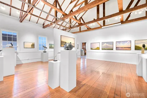a view of a living room with kitchen