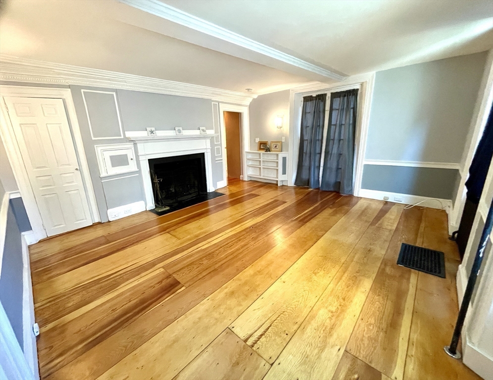 1 Green Street, Unit 2 Marblehead, MA 01945 - Photo 18 of 31 a bedroom with a bed and a fireplace