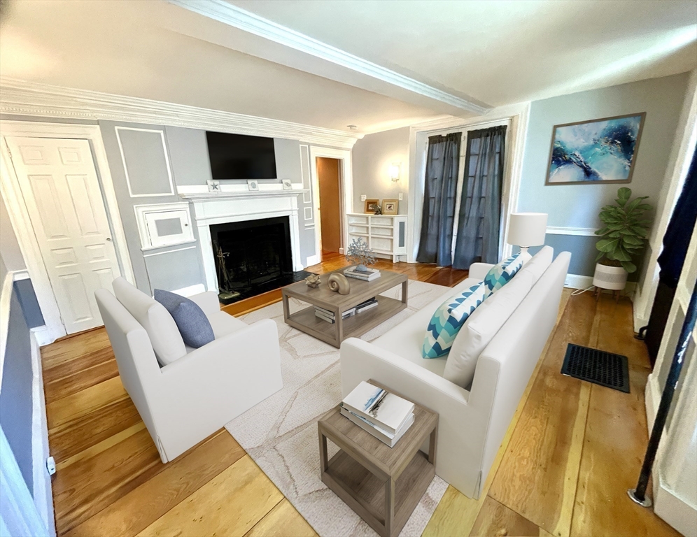 1 Green Street, Unit 2 Marblehead, MA 01945 - Photo 19 of 31 a living room with furniture fireplace and a flat screen tv