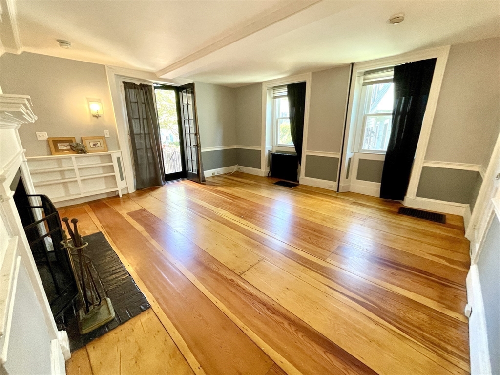 1 Green Street, Unit 2 Marblehead, MA 01945 - Photo 21 of 31 a view of a kitchen with furniture and wooden floor