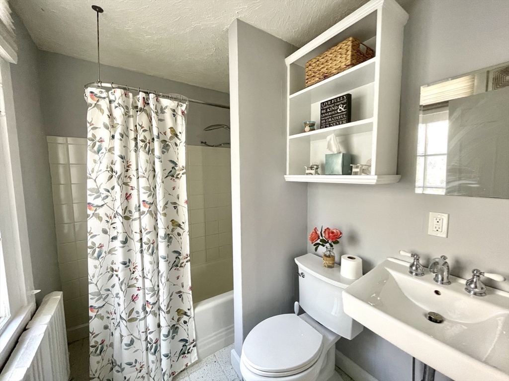 1 Green Street, Unit 2 Marblehead, MA 01945 - Photo 22 of 31 a bathroom with a sink toilet and shower