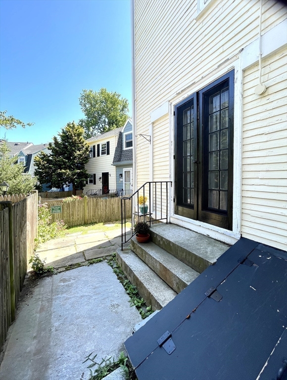 1 Green Street, Unit 2 Marblehead, MA 01945 - Photo 26 of 31 a view of a house with backyard and porch