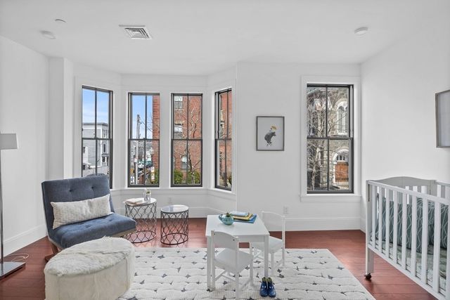 a living room with furniture and windows