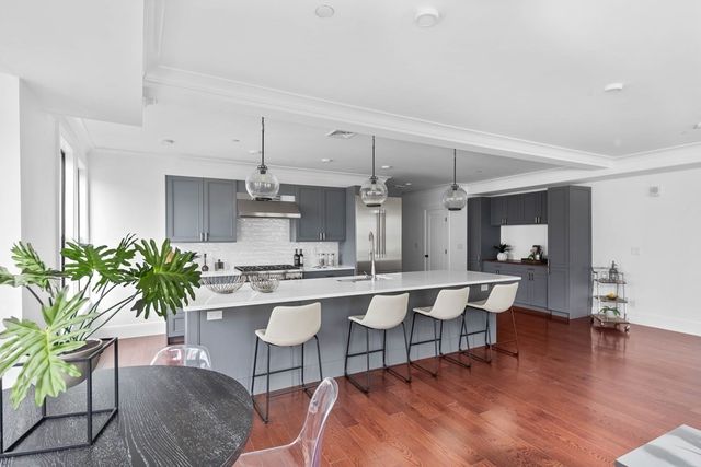 a kitchen with a table and chairs in it