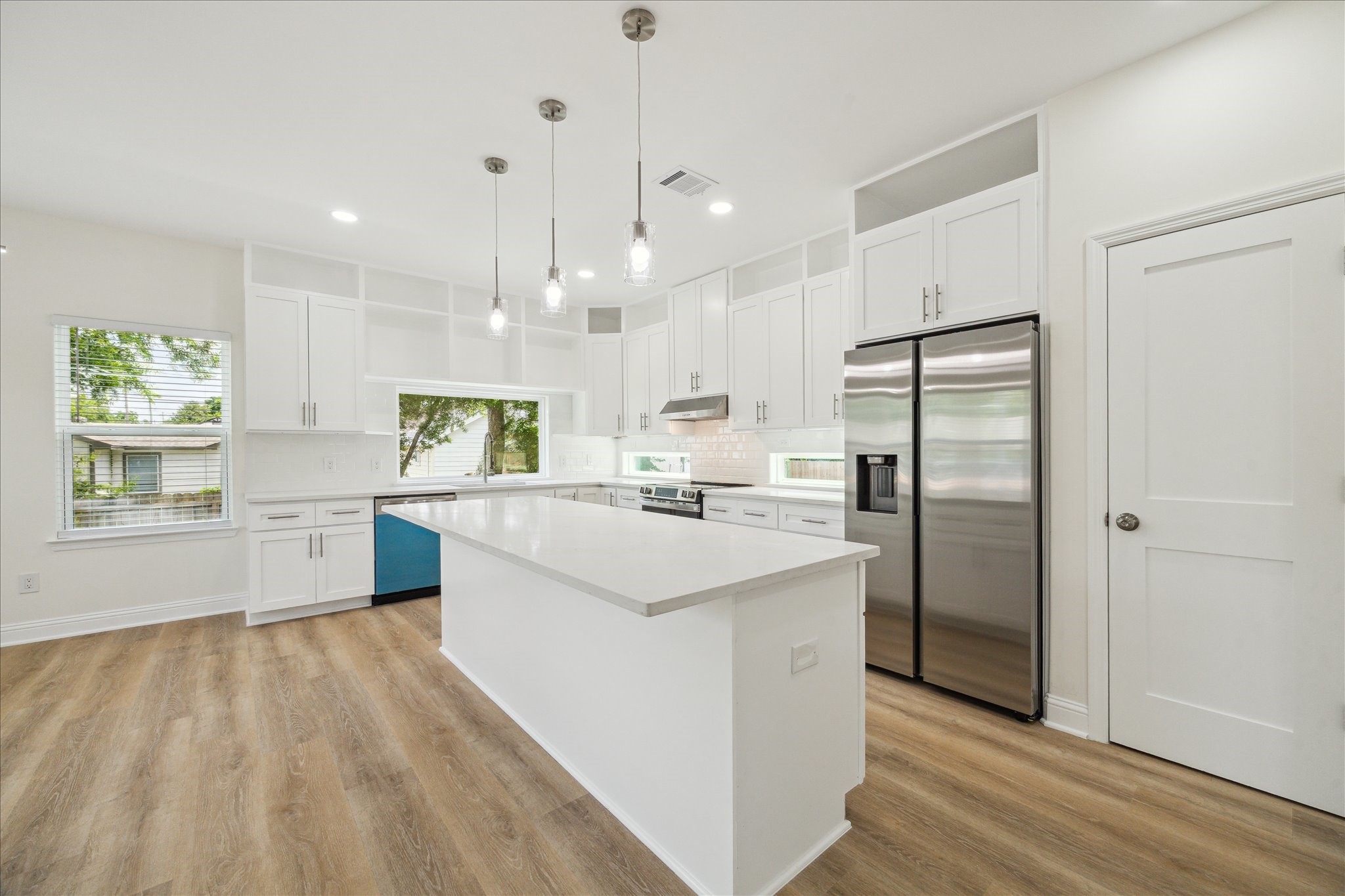 901 East 37th Street Houston, TX 77022 - Photo 7 of 19 a kitchen with kitchen island a sink stainless steel appliances and window
