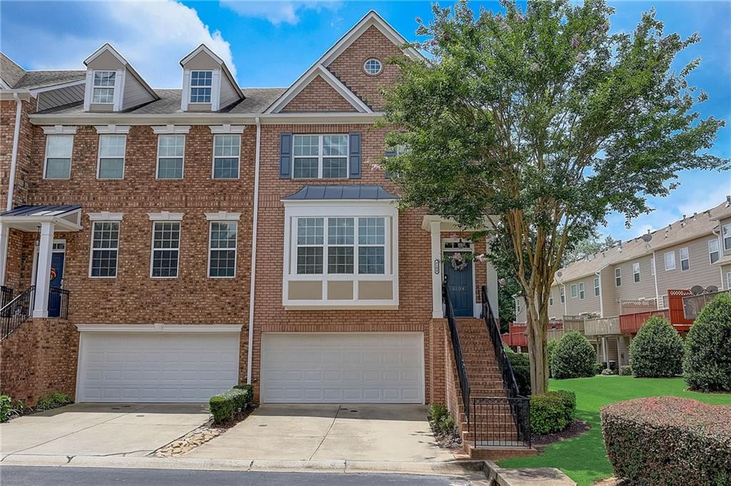 6104 Joybrook Road Duluth, GA 30097 - Photo 1 of 1 a front view of a house with a yard