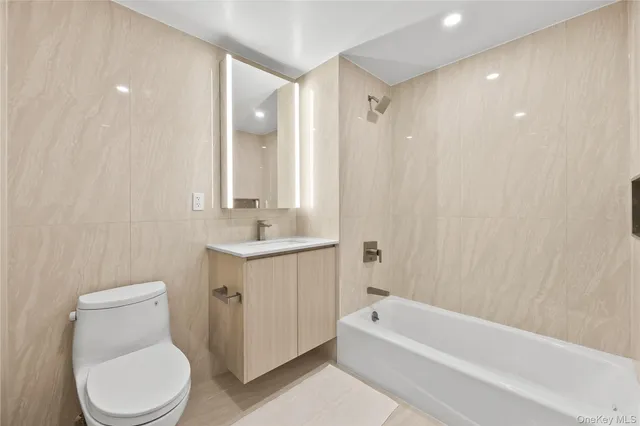 a bathroom with a toilet sink and bathtub