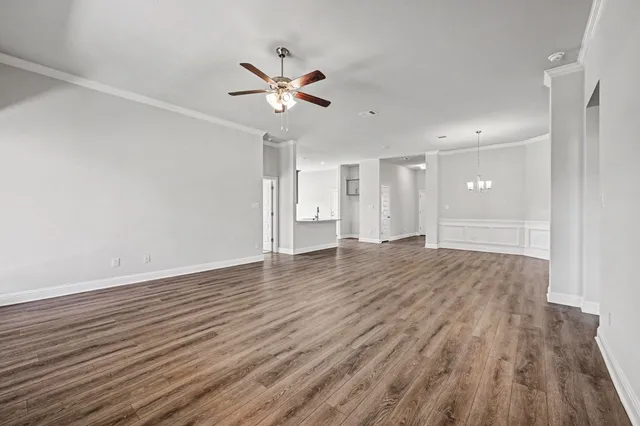 a view of an empty room and wooden floor
