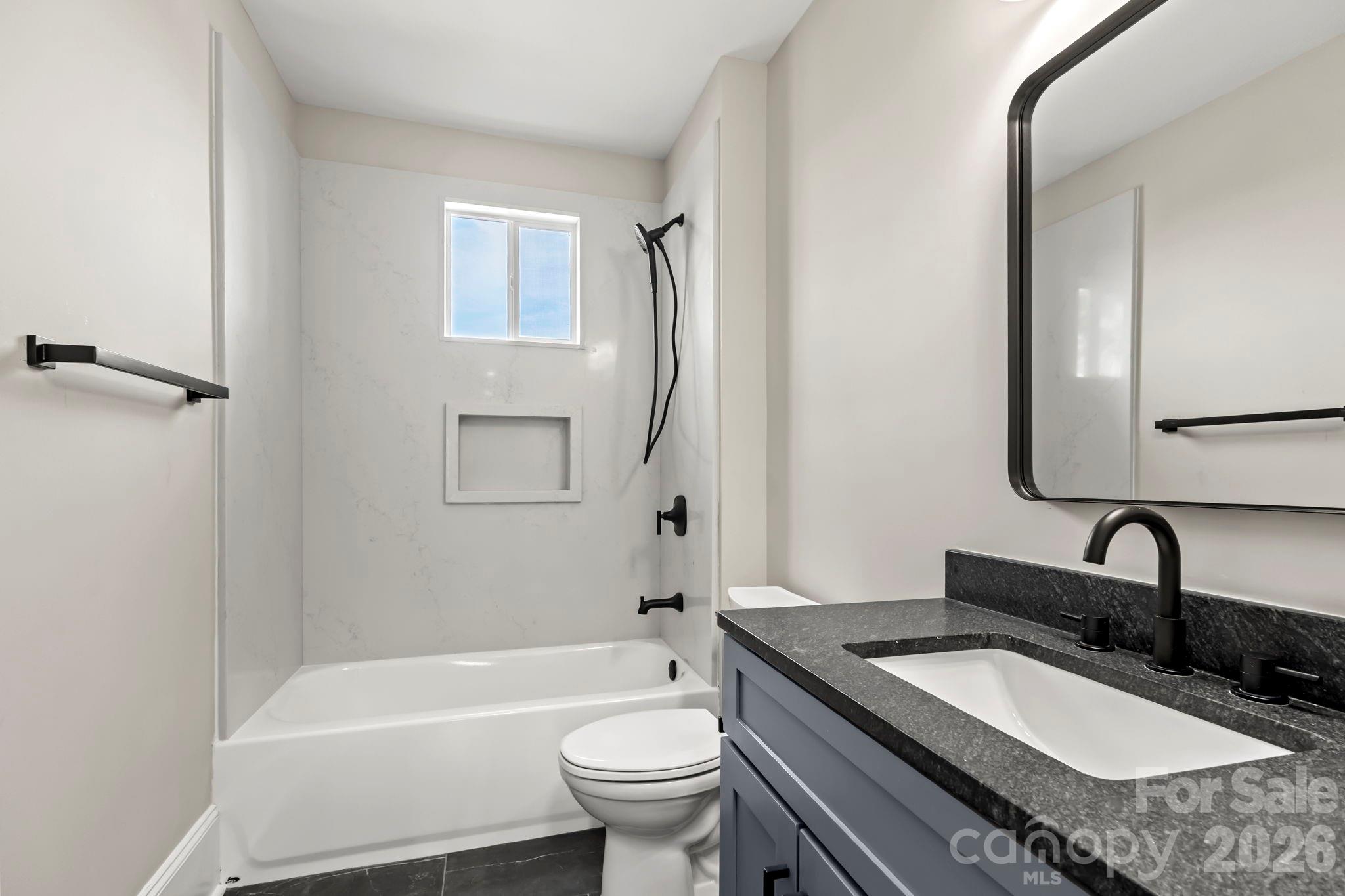 918 North New Hope Road Gastonia, NC 28054 - Photo 18 of 37 a bathroom with a granite countertop sink toilet and shower