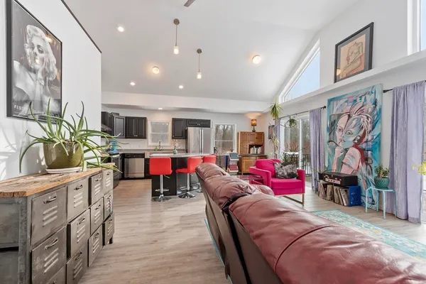 a bedroom with furniture and a flat screen tv
