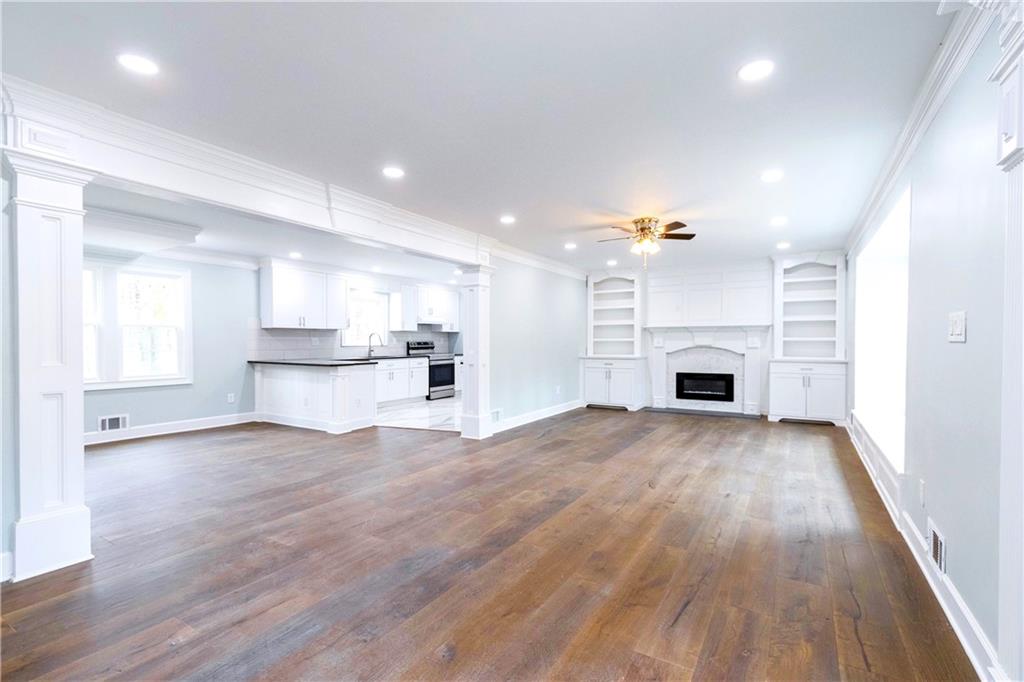 a view of kitchen with furniture and fireplace