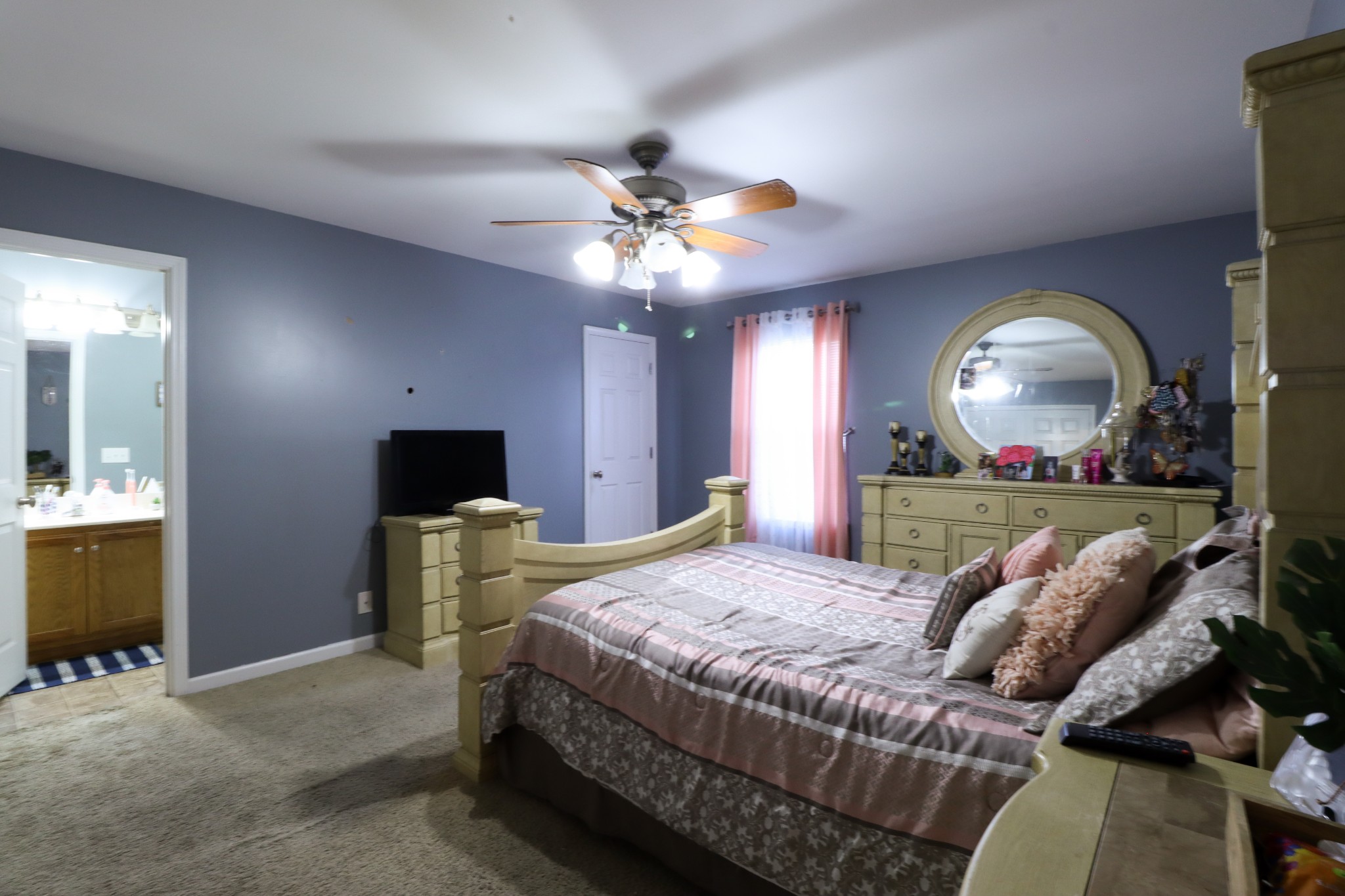 6183 H B Lee Road Springfield, TN 37172 - Photo 14 of 23 a living room with furniture a fireplace and a flat screen tv