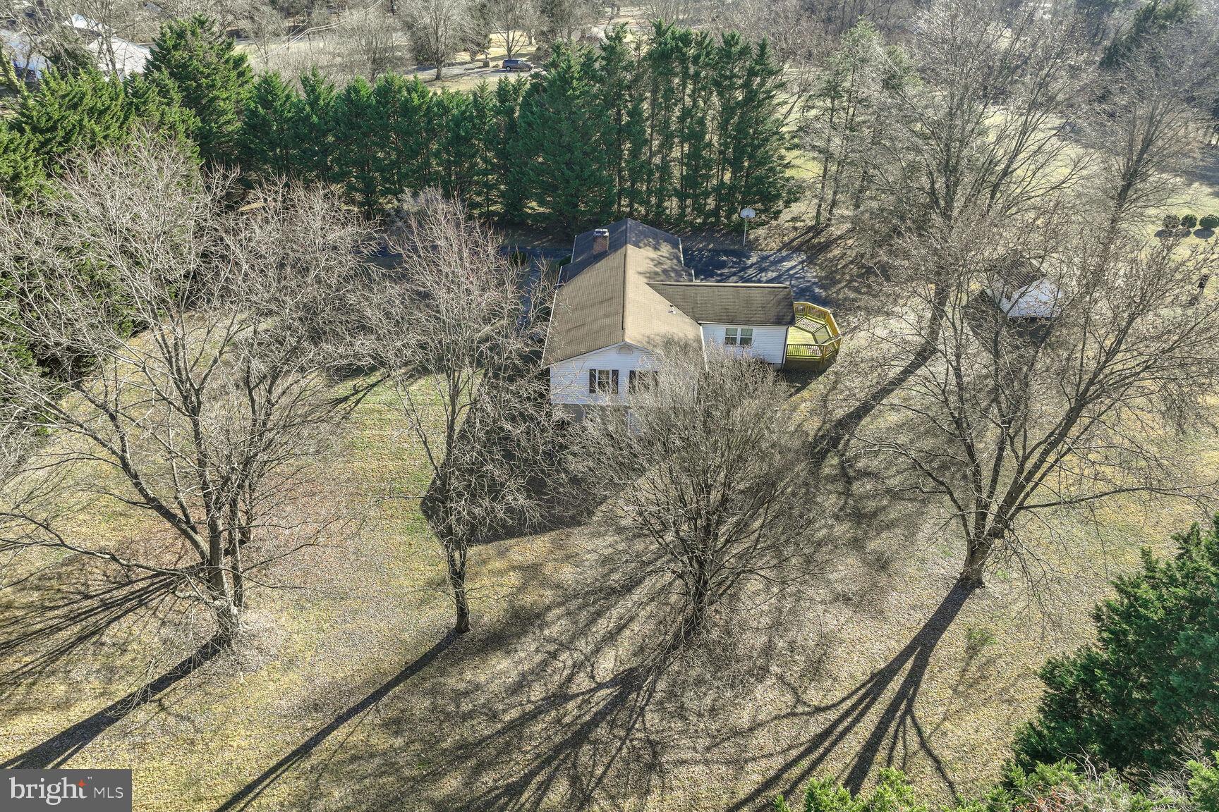 4710 Bready Road Rockville, MD 20853 - Photo 11 of 29 a aerial view of a house with large trees