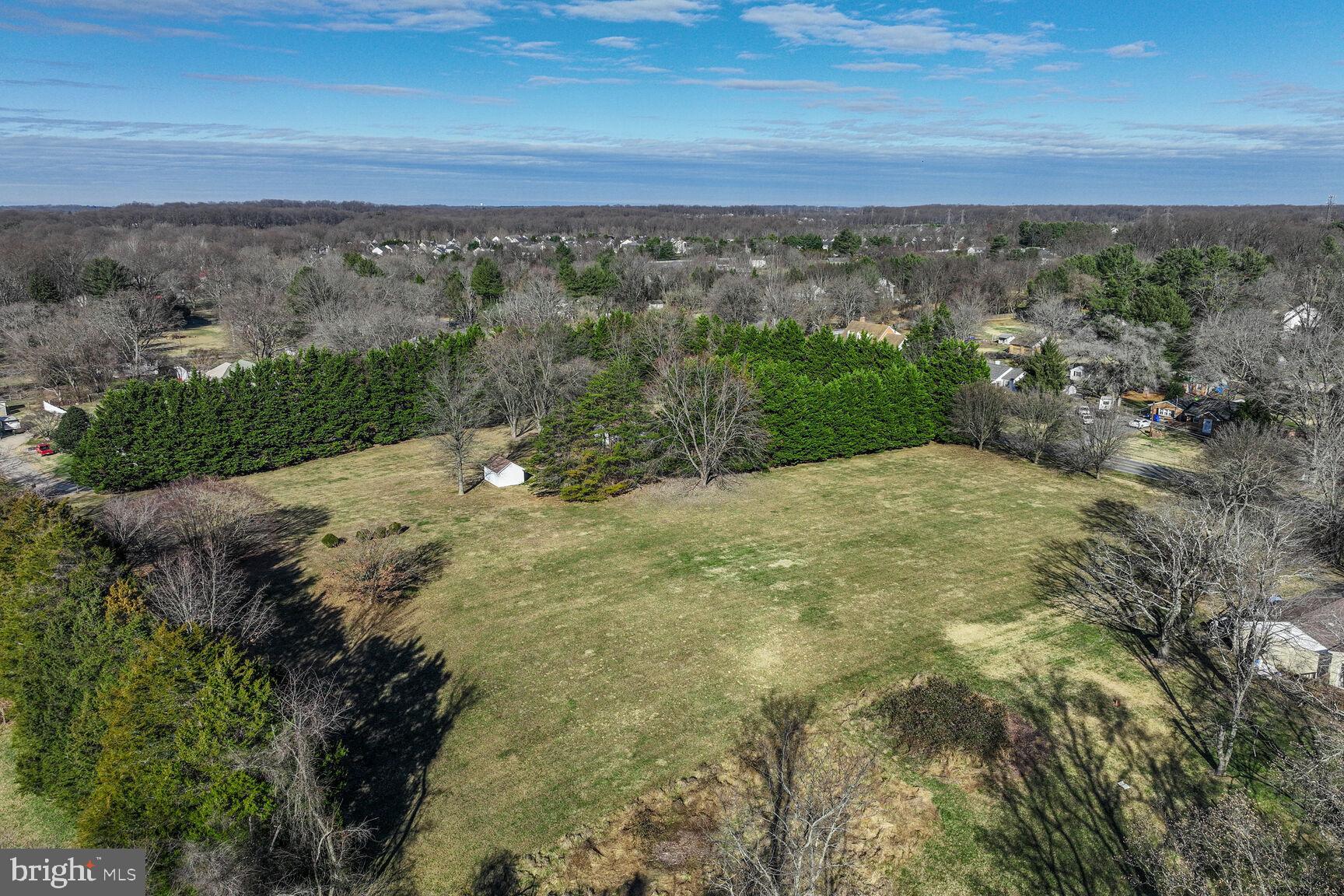 4710 Bready Road Rockville, MD 20853 - Photo 4 of 29 a view of a big yard with a lake view