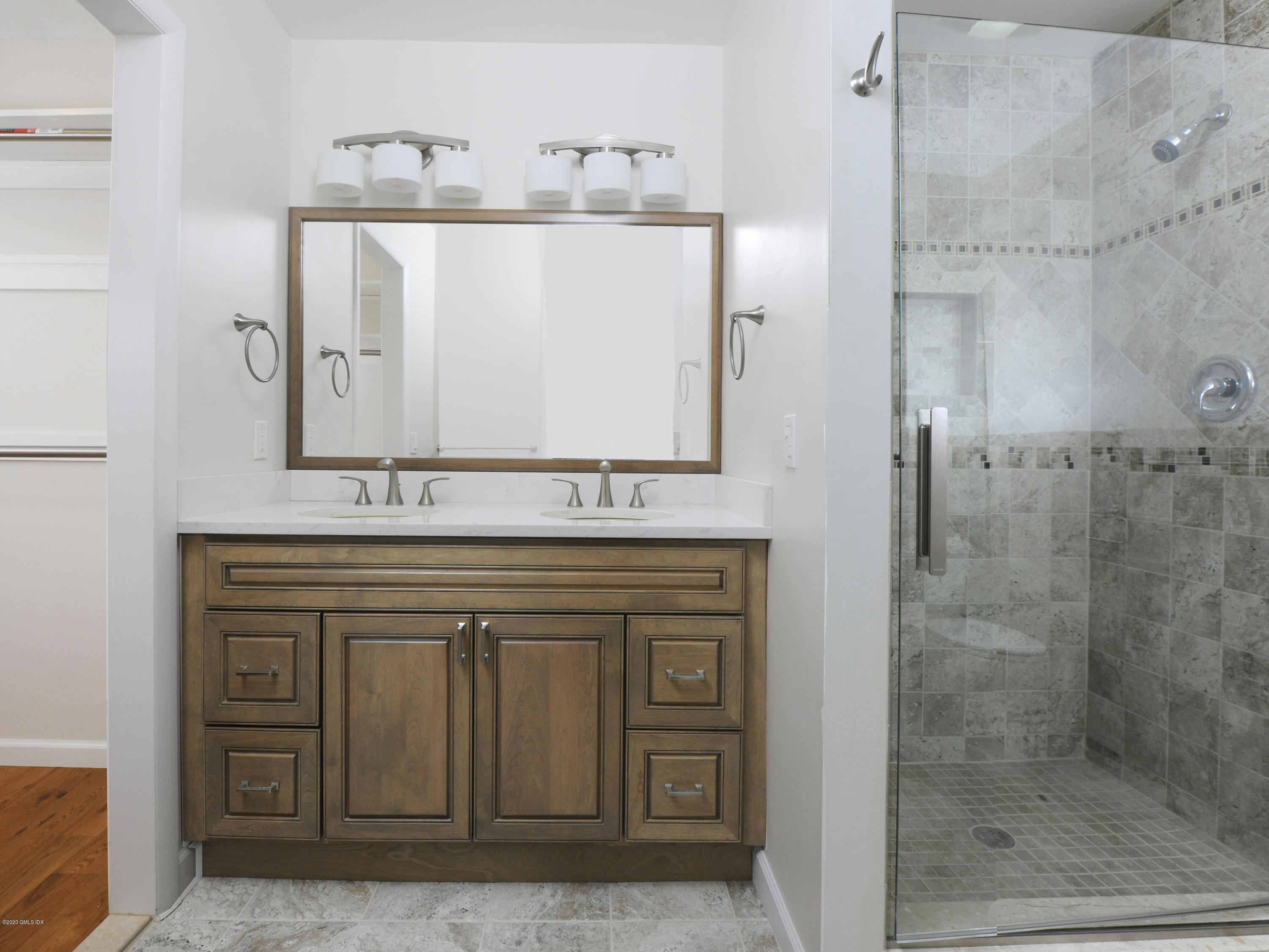 78 Silo Circle Riverside, CT 06878 - Photo 12 of 27 a bathroom with a sink a mirror and shower