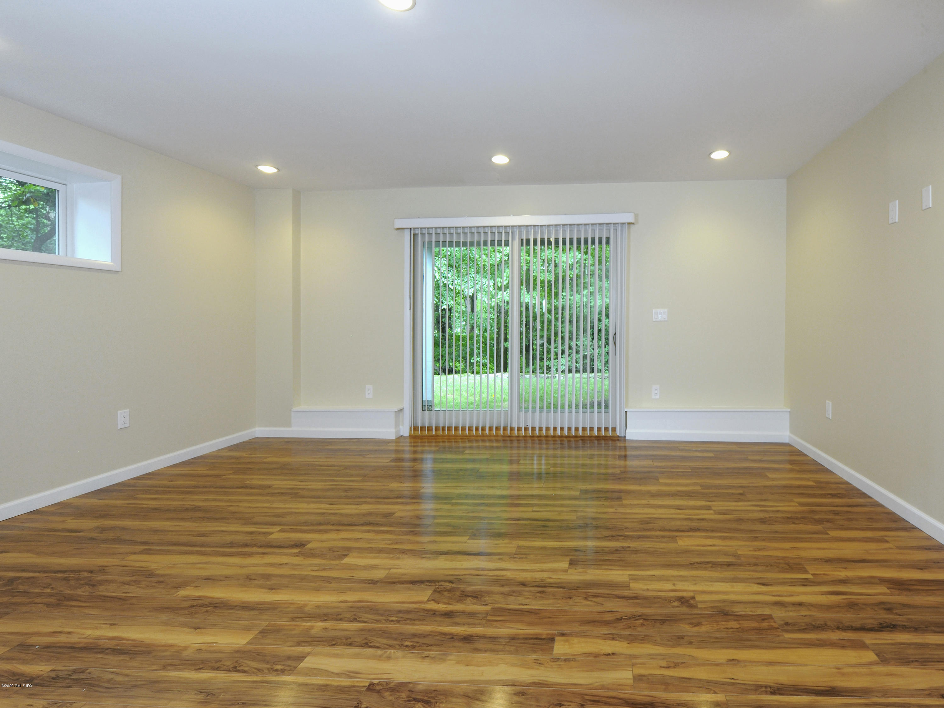 78 Silo Circle Riverside, CT 06878 - Photo 17 of 27 a view of empty room with wooden floor and fan