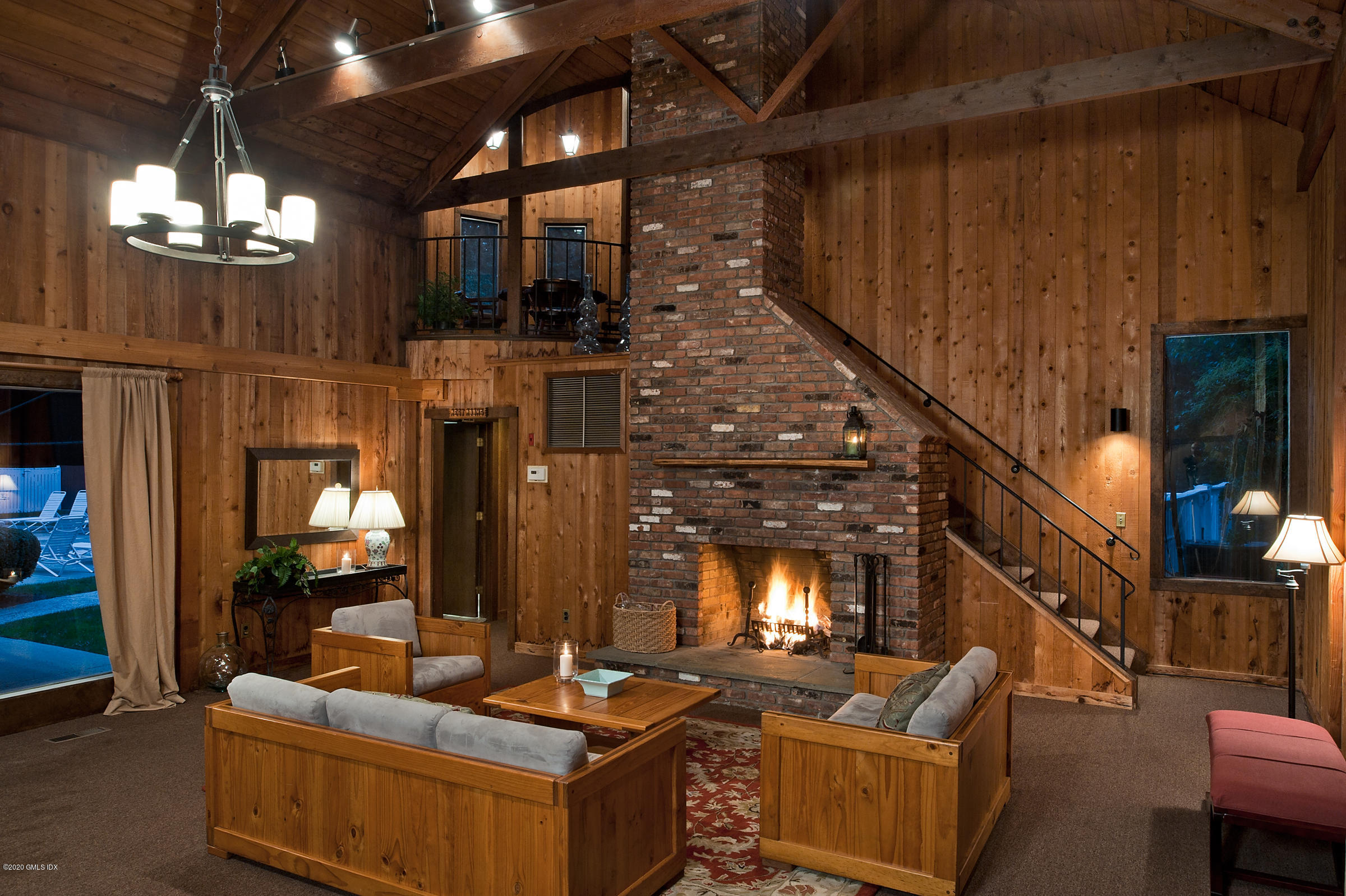 78 Silo Circle Riverside, CT 06878 - Photo 21 of 27 a living room with fireplace furniture and a chandelier