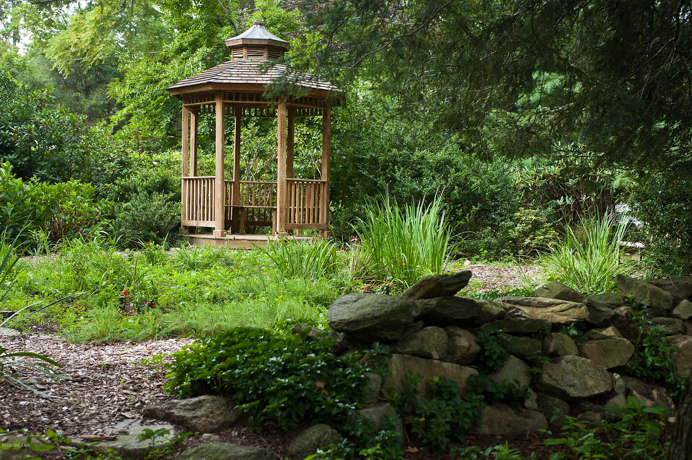 78 Silo Circle Riverside, CT 06878 - Photo 23 of 27 a view of a garden with plants