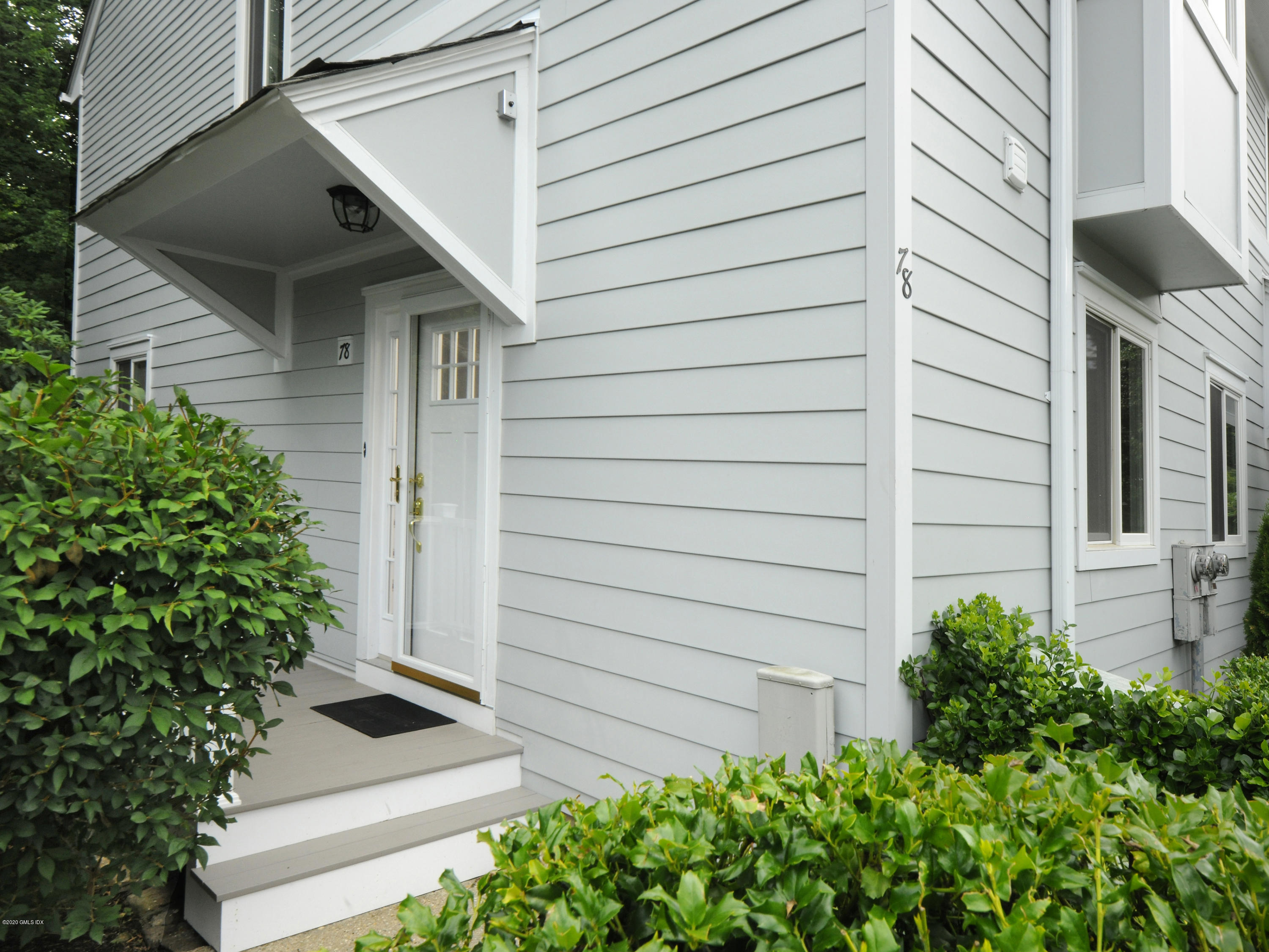 78 Silo Circle Riverside, CT 06878 - Photo 3 of 27 a view of front door and small plants
