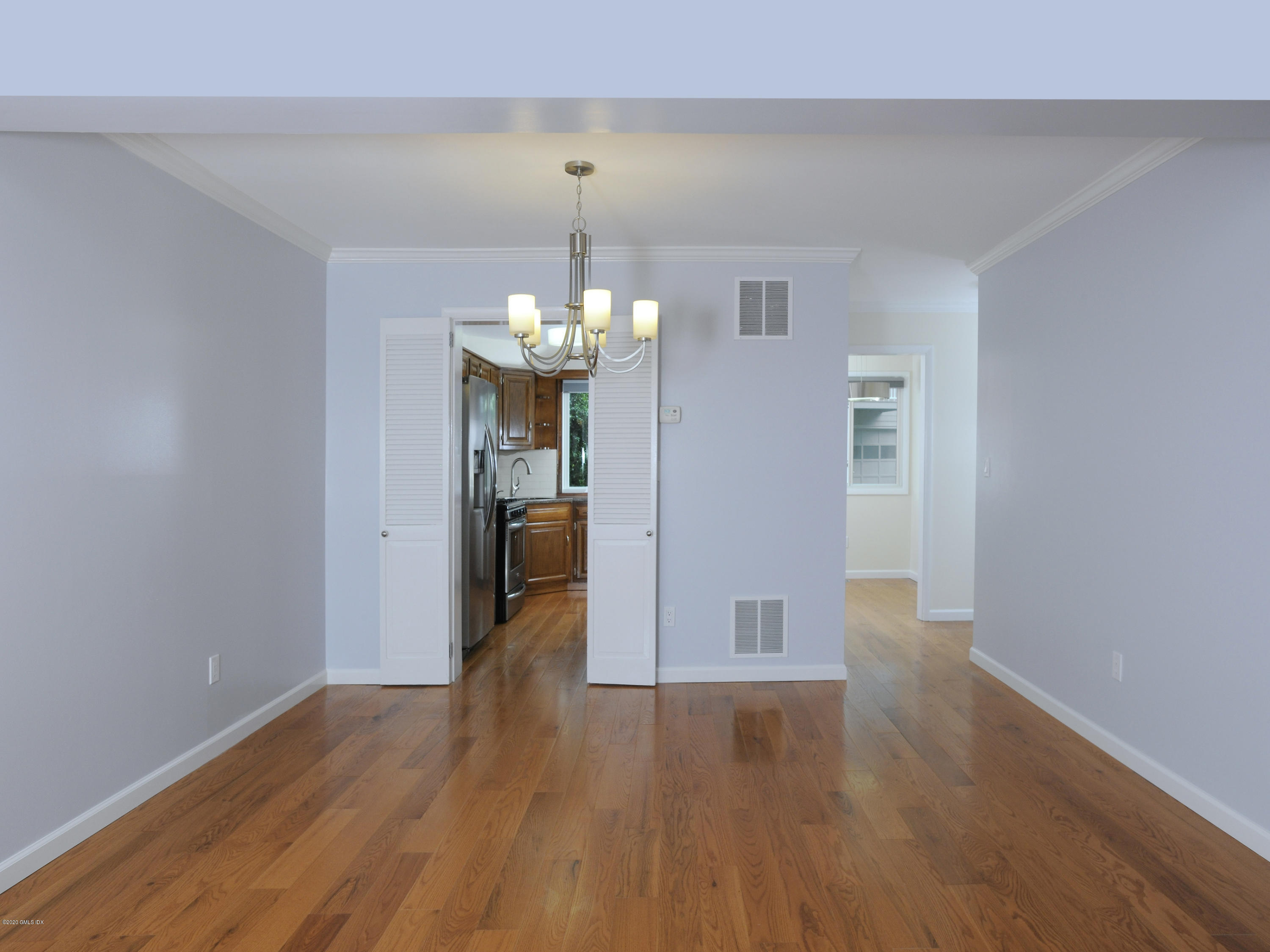 78 Silo Circle Riverside, CT 06878 - Photo 4 of 27 wooden floor in an empty room with a window