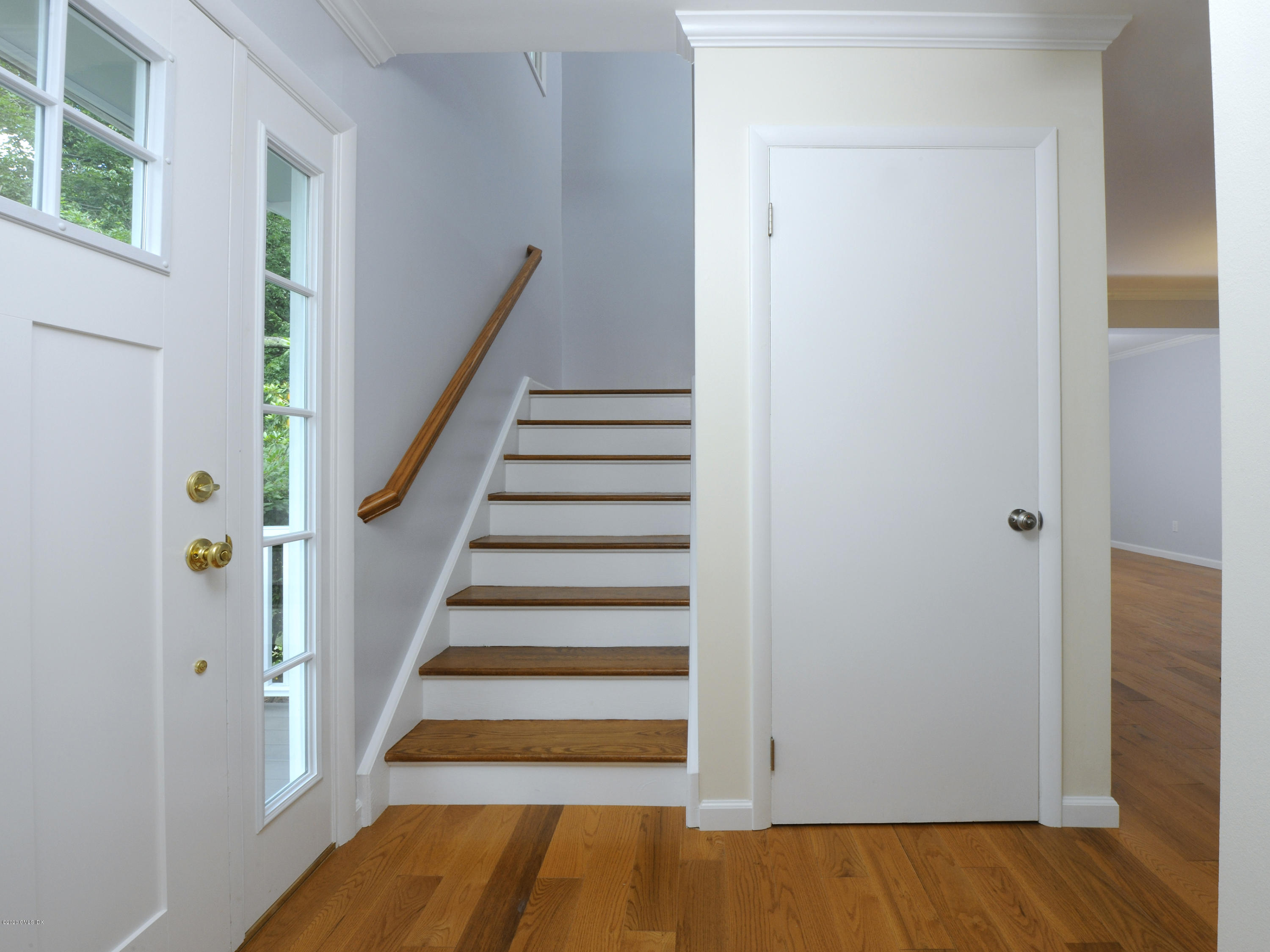 78 Silo Circle Riverside, CT 06878 - Photo 8 of 27 a view of entryway with wooden floor and stairs