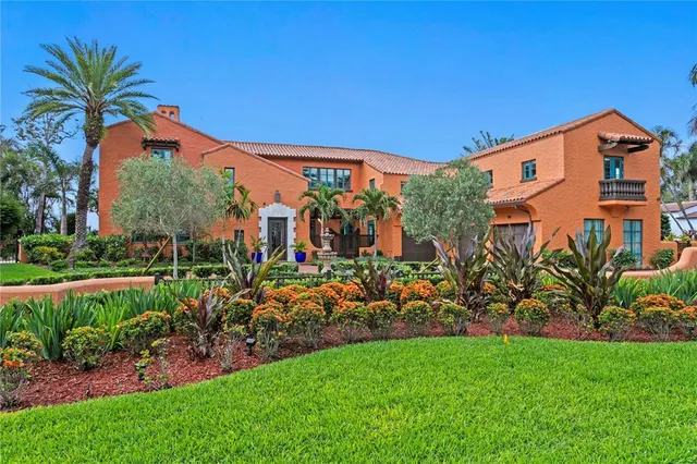 a front view of a house with a big yard
