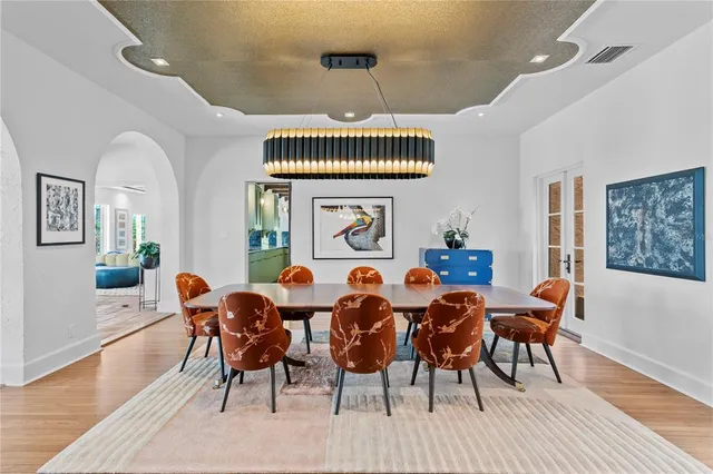 a living room with furniture and a mirror