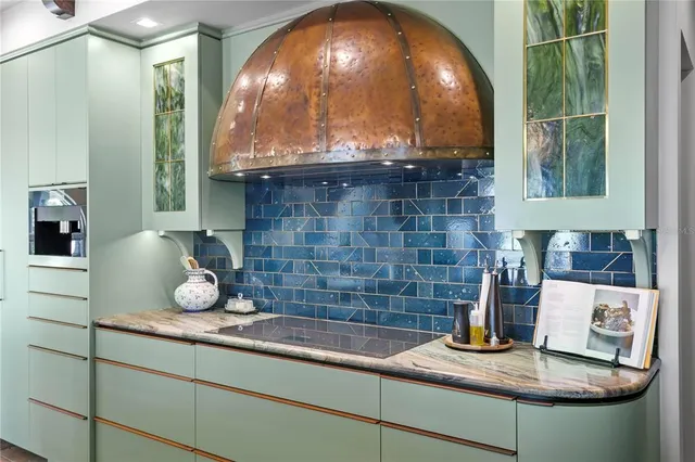 a kitchen with stainless steel appliances granite countertop a sink and cabinets