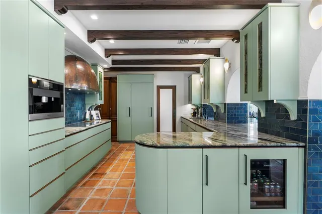 a view of a dining room with furniture and a window