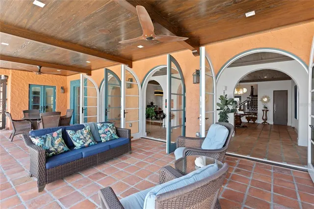 a view of a house with wooden floor and outdoor seating