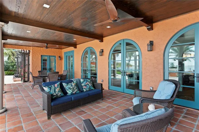 a bedroom with a large bed and a fireplace