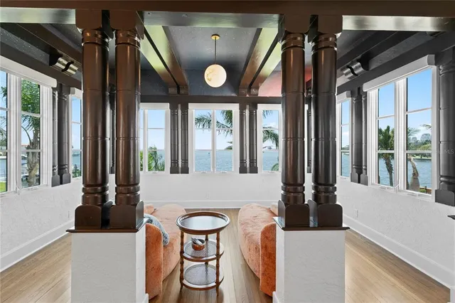 a front view of multi story residential apartment building with yard and sign board