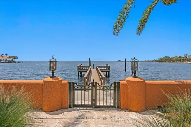 a lobby with furniture and a chandelier