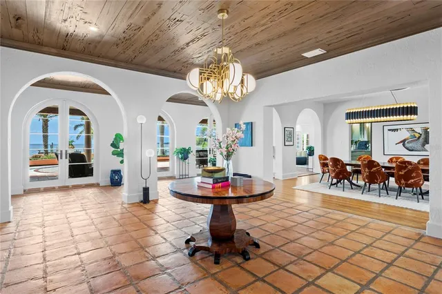 a dining room with a wooden table and chairs