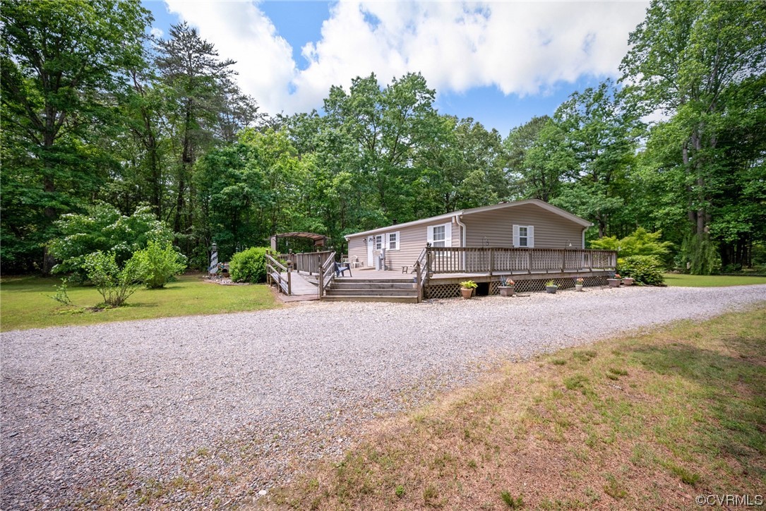 648 New Dragon Bridge Road Mascot, VA 23108 - Photo 1 of 43 a house with trees in the background
