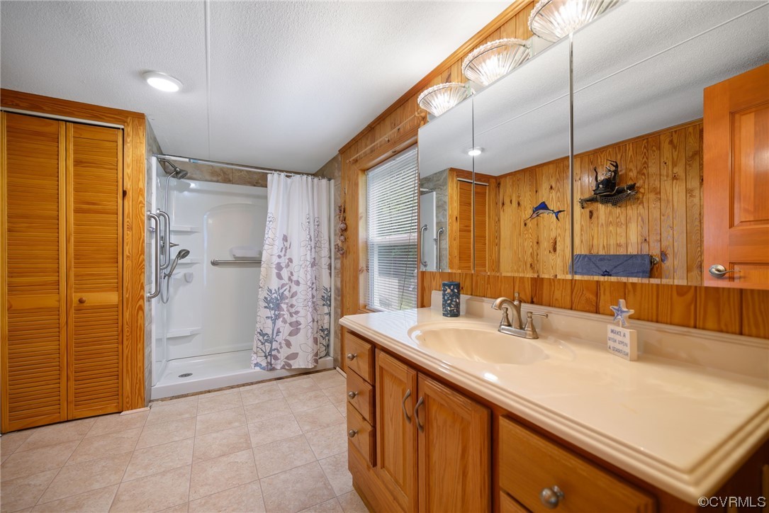 648 New Dragon Bridge Road Mascot, VA 23108 - Photo 12 of 43 a bathroom with a shower sink and mirror