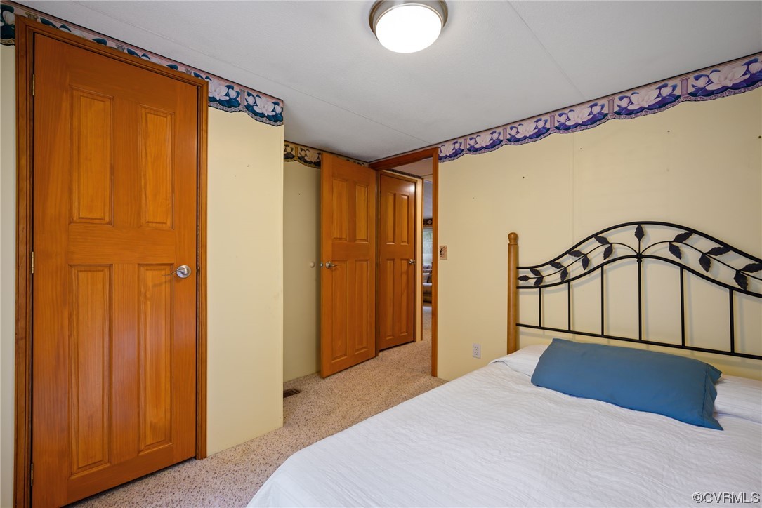 648 New Dragon Bridge Road Mascot, VA 23108 - Photo 13 of 43 a bedroom with a bed and a window