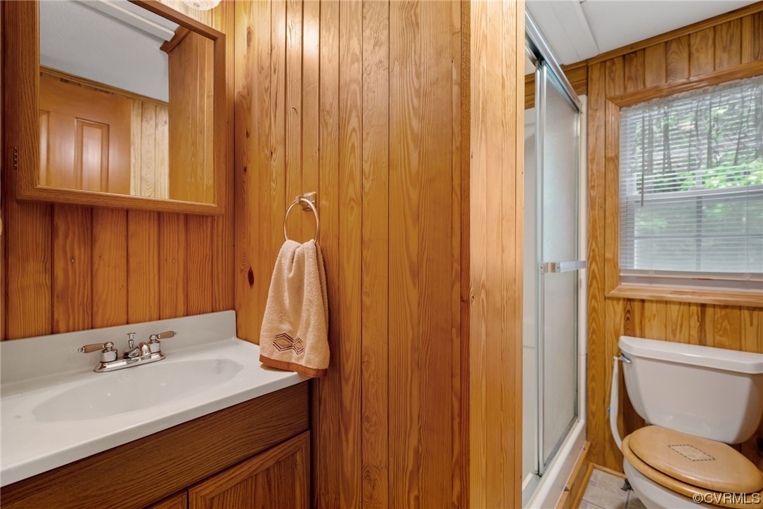 648 New Dragon Bridge Road Mascot, VA 23108 - Photo 15 of 43 a bathroom with a sink a toilet and a mirror