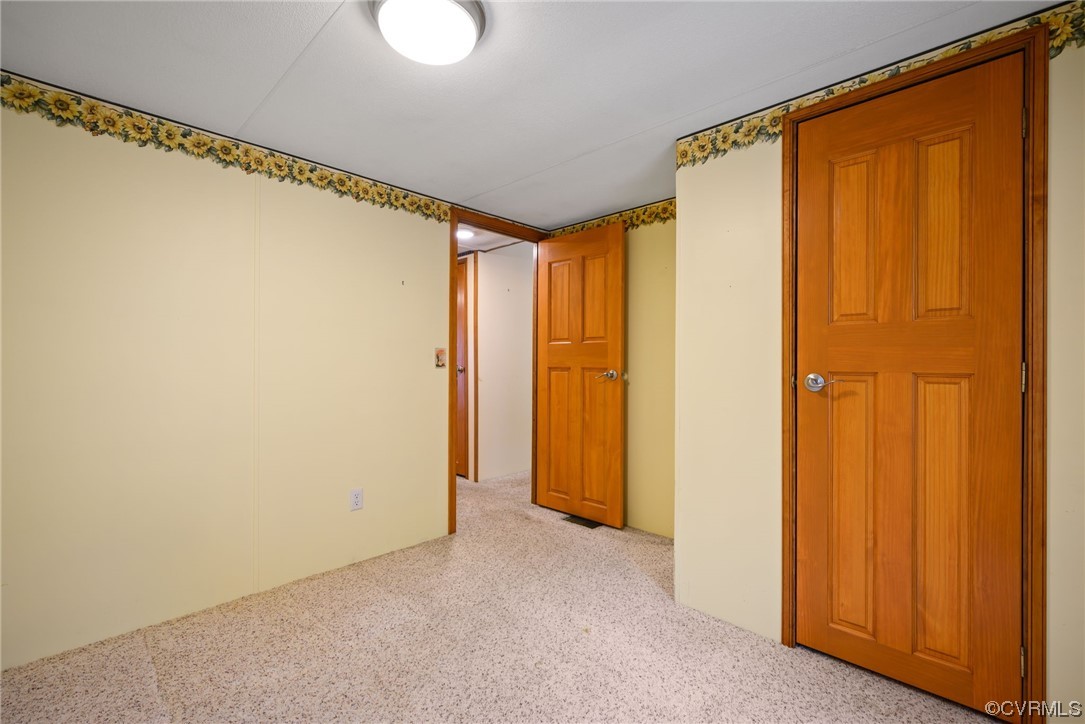 648 New Dragon Bridge Road Mascot, VA 23108 - Photo 16 of 43 a view of closet with wooden floor