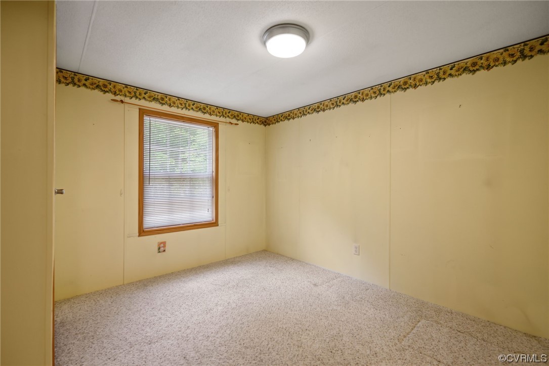 648 New Dragon Bridge Road Mascot, VA 23108 - Photo 17 of 43 a view of an empty room with a window