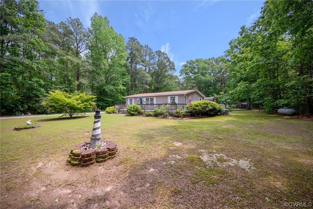 648 New Dragon Bridge Road Mascot, VA 23108 - Photo 2 of 43 a view of a lake with a house in the background