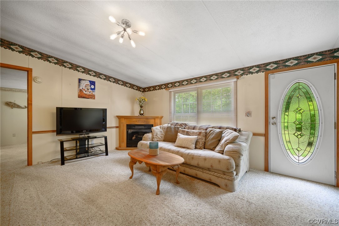 648 New Dragon Bridge Road Mascot, VA 23108 - Photo 4 of 43 a living room with furniture and a flat screen tv