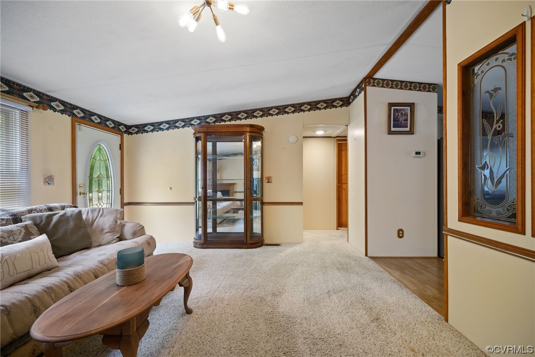 648 New Dragon Bridge Road Mascot, VA 23108 - Photo 5 of 43 a living room with furniture and a large window
