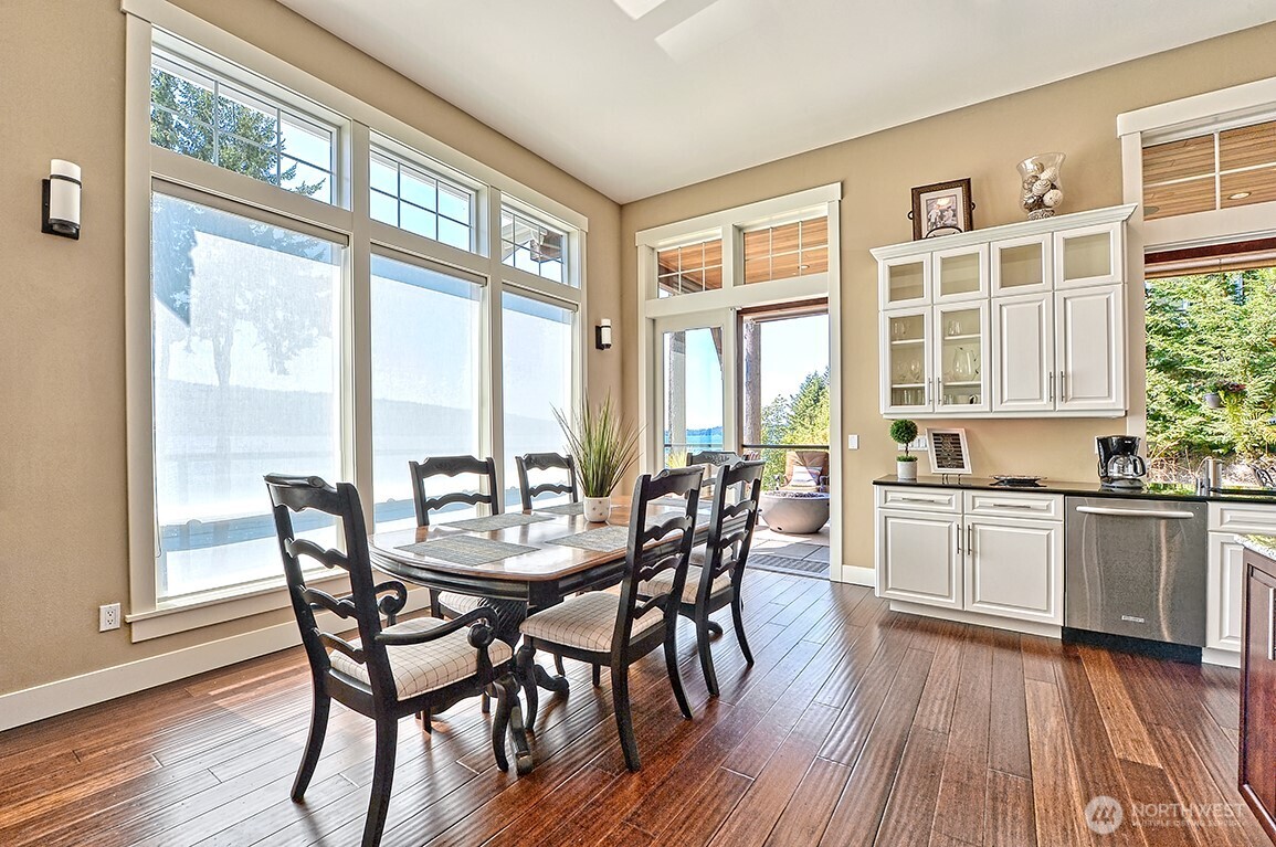 3042 North Shore Road Bellingham, WA 98226 - Photo 12 of 35 a view of a dining room with furniture windows and wooden floor