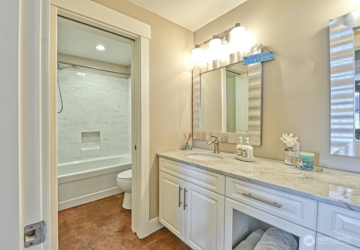 3042 North Shore Road Bellingham, WA 98226 - Photo 14 of 35 a bathroom with a granite countertop sink mirror and a bathtub