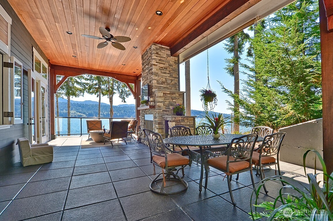 3042 North Shore Road Bellingham, WA 98226 - Photo 17 of 35 a view of a patio with a table and chairs
