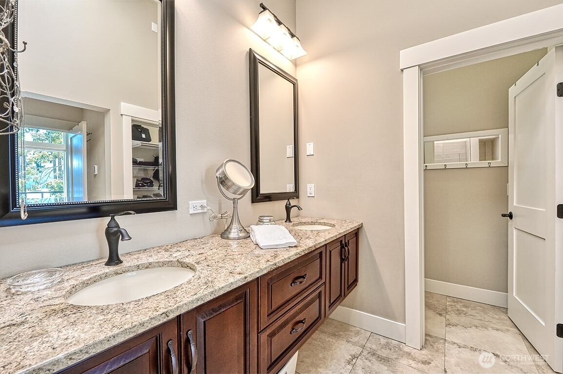 3042 North Shore Road Bellingham, WA 98226 - Photo 23 of 35 a bathroom with a granite countertop sink and a mirror